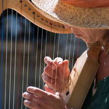 Woman playing the harp by archeon